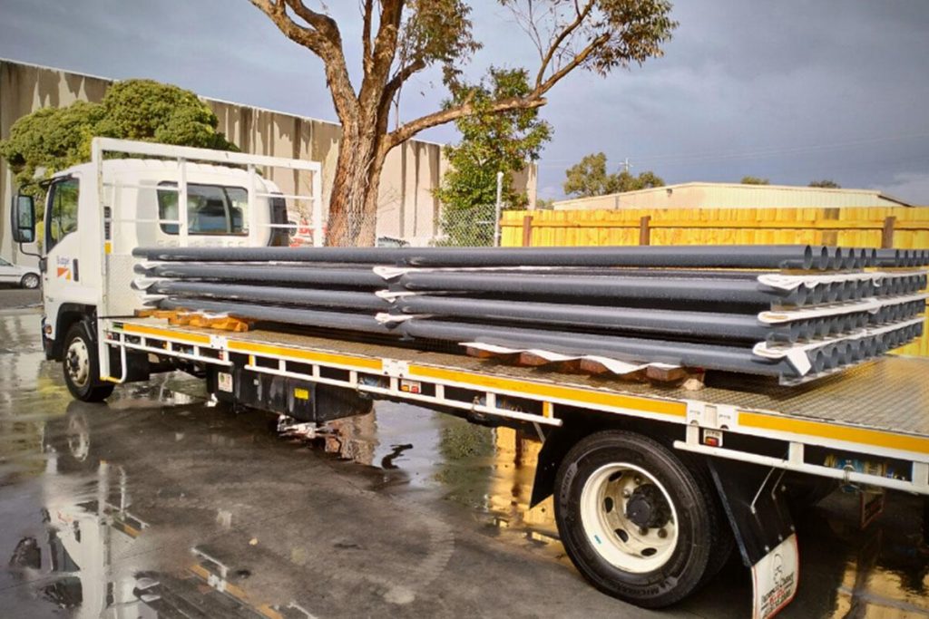 Truck with metal sheets on the tray.